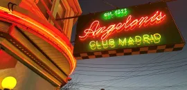  Angeloni's Club Madrid exterior with neon sign.
