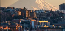 Skyline of Seattle from the waterfront, with Mt. Rainier in the background.