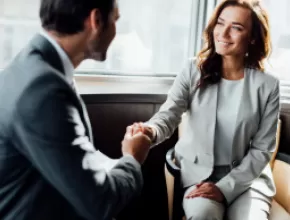 Man and woman shaking hands