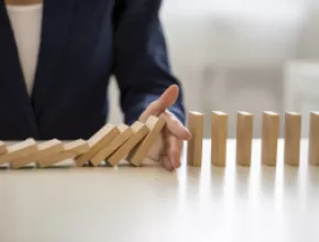 Risk management dominos graphic.