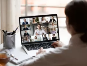 Woman sitting in front of laptop.