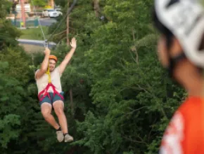 Photo of man ziplining at Wilderness Resort, Wisconsin Dells, Wisconsin.