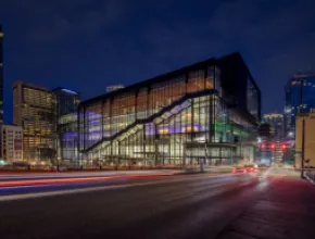 Photo of exterior of Seattle Convention Center Summit building at night.