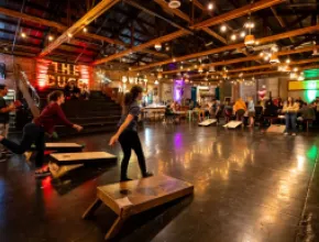 Photo of people playing cornhole at The Duce lounge in Phoenix.