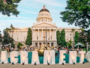 Event behind Sacramento sign