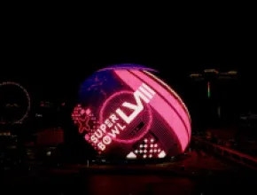 Super Bowl ad on the Sphere exterior in Las Vegas at nighttime