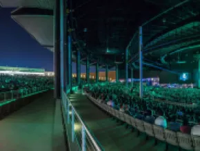 Photo of crowd at night at The Pavilion at Toyota Music Factory.