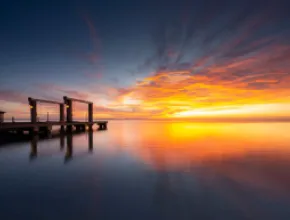 Photo of a sunset and a pier in South Padre Island, Texas.