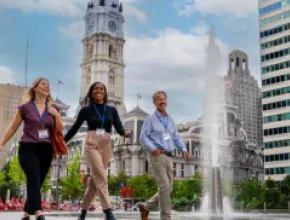 Convention attendees walking in front of City Hall in Philadelphia