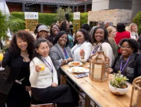 Clara Carter (middle) with attendees at the 2024 WITH Conference