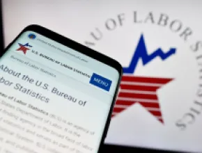 Graphic of U.S. Labor Statistics logo on cell phone and computer screen.