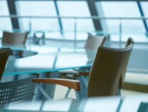 Modern conference room with windows and a glass table