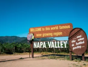 Photo of Napa Valley welcome sign in vineyard.