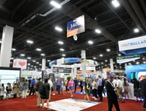 Photo of group of people on the exhibit floor at IMEX America 2023.