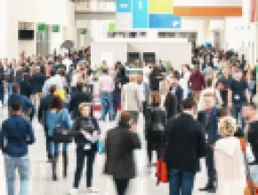 Image of a crowd of people at an event, walking.