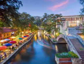 Photo of the San Antonio River Walk at dusk.