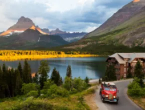 Red bus tour in Glacier National Park’s Many Glacier Valley.