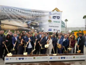 officials hold shovels at groundbreaking ceremony