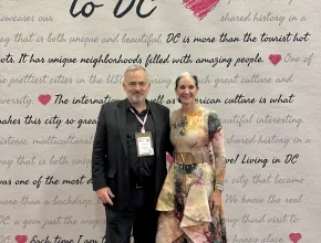 Senior Contributor Jeff Heilman and Melissa A. Riley, SVP of convention sales and services for Destination DC at Love Letter wall at IMEX.