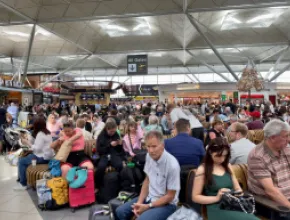 image of travelers stuck in an airport