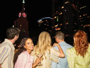 Five people enjoy Dallas night life. 