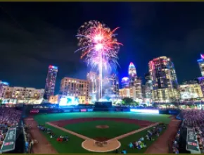 Truist Field, with fireworks and the skyline of Charlotte, North Carolina, in the background.