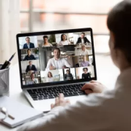 Woman sitting in front of laptop.