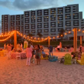 Event setup on the beach with twinkle lights in front of Fort Lauderdale Marriott Harbor Beach Resort & Spa 
