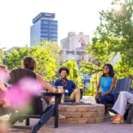 Meeting attendees sitting in a circle outside in Reno Tahoe