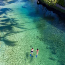 Snorkelers in a lagoon. Credit - Hilton Waikoloa Village