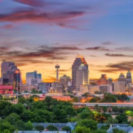Photo of San Antonio skyline at dusk.