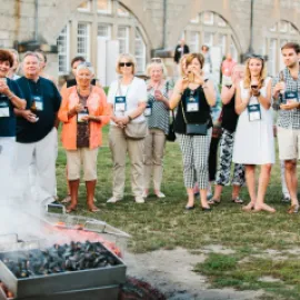 Group of attendees watching a clam bake at Fort Adams in Newport, Rhode Island