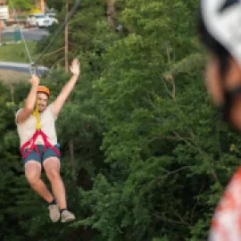 Photo of man ziplining at Wilderness Resort, Wisconsin Dells, Wisconsin.