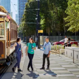 Meeting attendees outside of the trolley in downtown Dallas