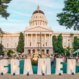 Event behind Sacramento sign