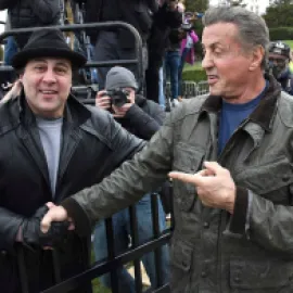 Mike Kunda and Sylvester Stallone shaking hands