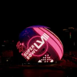 Super Bowl ad on the Sphere exterior in Las Vegas at nighttime