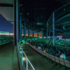 Photo of crowd at night at The Pavilion at Toyota Music Factory.