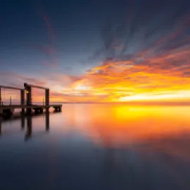 Photo of a sunset and a pier in South Padre Island, Texas.