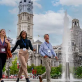 Convention attendees walking in front of City Hall in Philadelphia