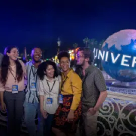 Attendees in front of Universal Orlando globe