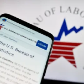 Graphic of U.S. Labor Statistics logo on cell phone and computer screen.