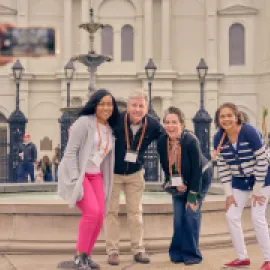 Group of meeting attendees pose for a photo in New Orleans