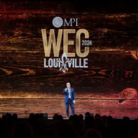 Photo of Paul Van Deventer on stage at MPI WEC 2024.