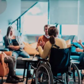 Woman in wheelchair at a business meeting