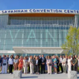 Photo of Savannah convention center and DMO community gathered in front of the expanded Savannah Convention Center.