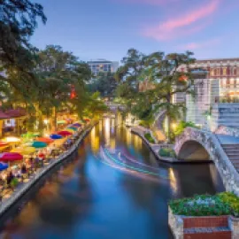 Photo of the San Antonio River Walk at dusk.