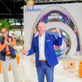 Mike Waterman cutting the ribbon on Visit Anaheim's new tradeshow booth at IPW.