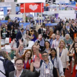 Group of attendees on exhibit floor at IMEX America 2024.