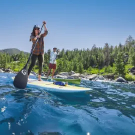 Couple paddleboarding on Lake Tahoe. 